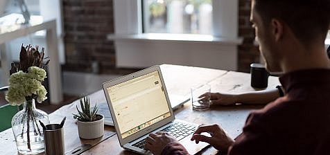 Man at a laptop in an office